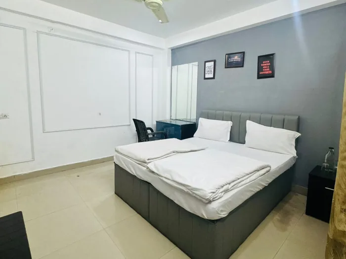 Guest room with a dressing table and a large bed